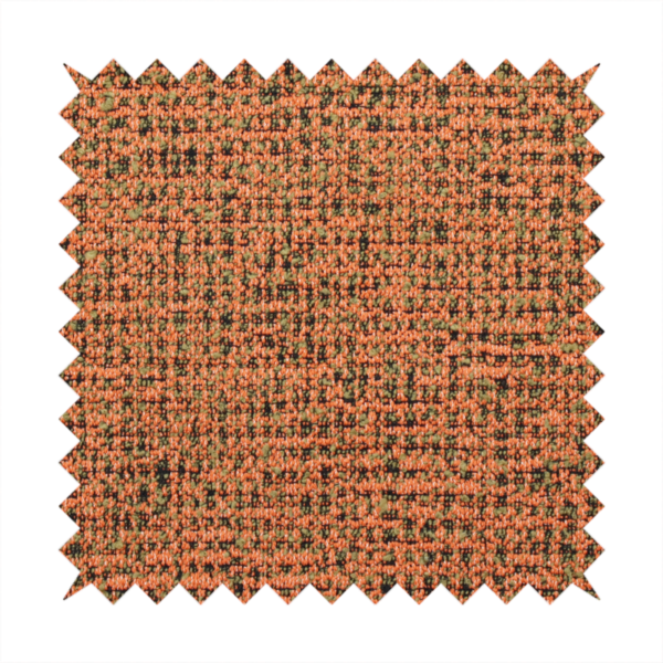 A textured, woven fabric featuring a complex pattern of orange, green, and dark threads, creating a speckled and mottled appearance.