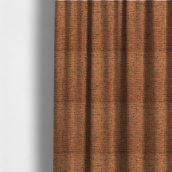 The fabric used to create these made-to-measure curtains is a textured, woven fabric featuring a complex pattern of orange, green, and dark threads, creating a speckled and mottled appearance.