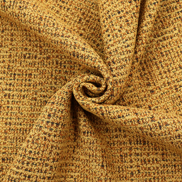 A textured, woven fabric featuring a complex pattern of yellow, dark, and beige threads, creating a speckled and mottled appearance.