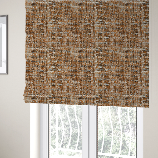 the fabric used to create these Roman blinds is a textured, woven fabric featuring a complex pattern of brown, white, and dark threads, creating a speckled and mottled appearance.