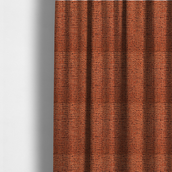 The fabric used to create these made-to-measure curtains is a textured, woven fabric featuring a complex pattern of orange, dark, and beige threads, creating a speckled and mottled appearance.