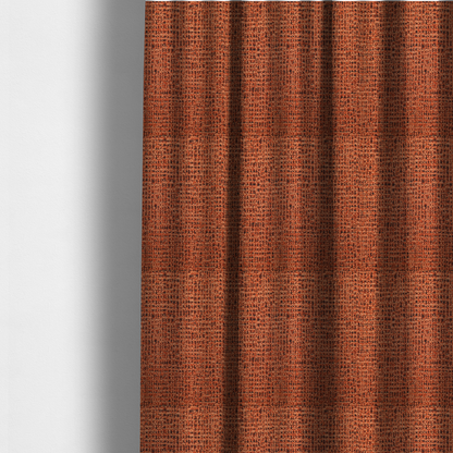 The fabric used to create these made-to-measure curtains is a textured, woven fabric featuring a complex pattern of orange, dark, and beige threads, creating a speckled and mottled appearance.