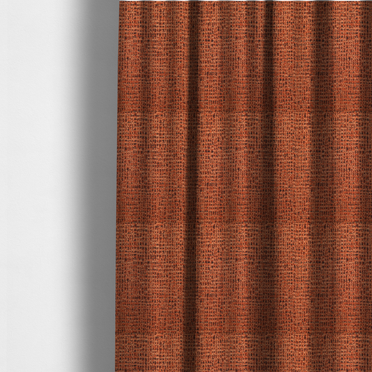 The fabric used to create these made-to-measure curtains is a textured, woven fabric featuring a complex pattern of orange, dark, and beige threads, creating a speckled and mottled appearance.