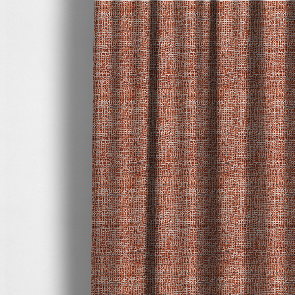 The fabric used to create these made-to-measure curtains is a textured, woven fabric featuring a complex pattern of orange, white, and dark threads, creating a speckled and mottled appearance.