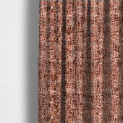 The fabric used to create these made-to-measure curtains is a textured, woven fabric featuring a complex pattern of orange, white, and dark threads, creating a speckled and mottled appearance.