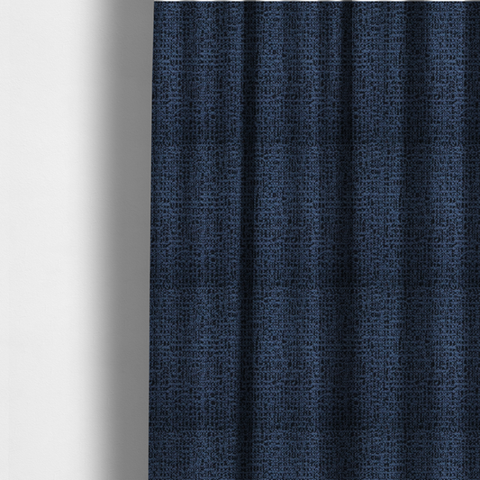 The fabric used to create these made-to-measure curtains is a textured, woven fabric featuring a complex pattern of blue, dark, and navy threads, creating a speckled and mottled appearance.