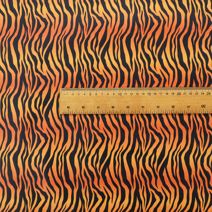 A vibrant, repeating tiger-stripe pattern featuring vertical black wavy stripes over an orange-to-yellow gradient background.