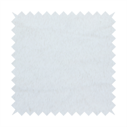 A snow-white faux fur. The material has a dense, soft pile with subtle shadows and highlights that showcase its fluffy, velvety texture.