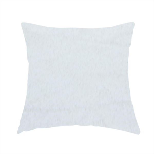 The fabric used to create this handmade cushion is a snow-white faux fur. The material has a dense, soft pile with subtle shadows and highlights that showcase its fluffy, velvety texture.