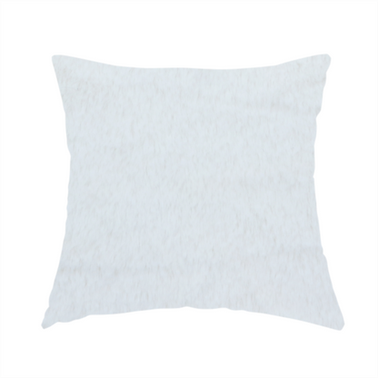 The fabric used to create this handmade cushion is a snow-white faux fur. The material has a dense, soft pile with subtle shadows and highlights that showcase its fluffy, velvety texture.
