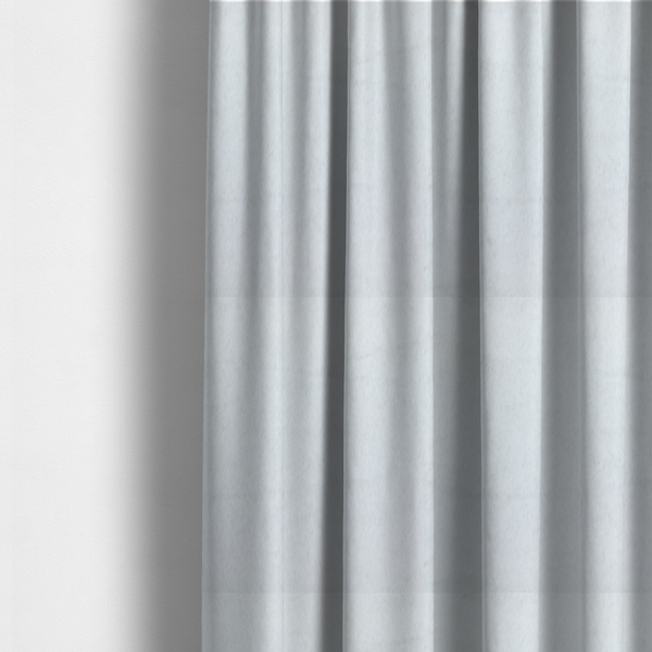 The fabric used to create these made-to-measure curtains is a snow-white faux fur. The material has a dense, soft pile with subtle shadows and highlights that showcase its fluffy, velvety texture.