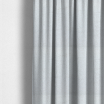 The fabric used to create these made-to-measure curtains is a snow-white faux fur. The material has a dense, soft pile with subtle shadows and highlights that showcase its fluffy, velvety texture.