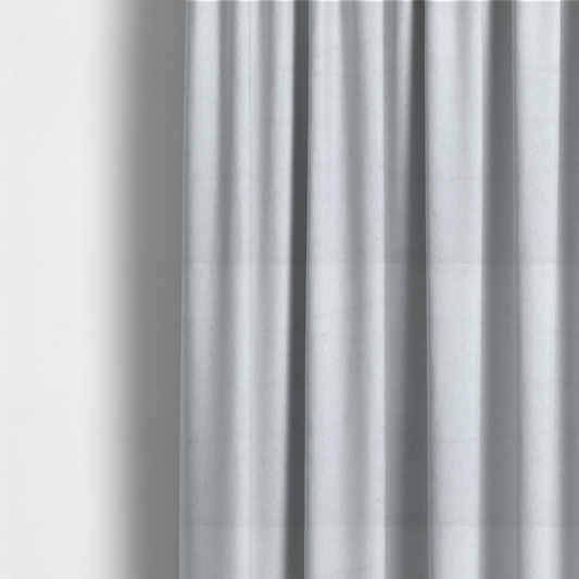 The fabric used to create these made-to-measure curtains is a snow-white faux fur. The material has a dense, soft pile with subtle shadows and highlights that showcase its fluffy, velvety texture.