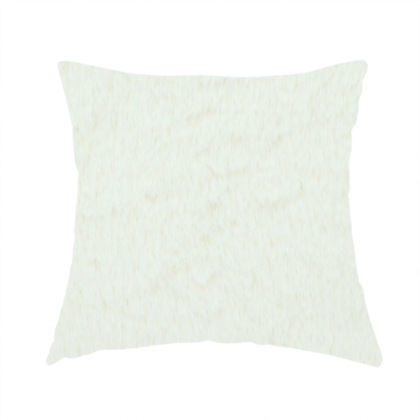 The fabric used to create this handmade cushion is a cream-coloured faux fur. The material features a thick, plush pile with a soft sheen, showing a warm ivory tint compared to pure white.