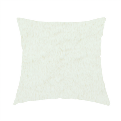 The fabric used to create this handmade cushion is a cream-coloured faux fur. The material features a thick, plush pile with a soft sheen, showing a warm ivory tint compared to pure white.