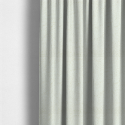 The fabric used to create these made-to-measure curtains is a cream-colored faux fur. The material features a thick, plush pile with a soft sheen, showing a warm ivory tint compared to pure white.