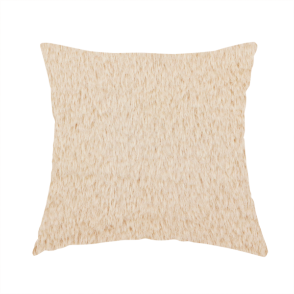 The fabric used to create this handmade cushion is a high-quality faux fur fabric in a warm, sandy beige or light camel hue. The material features a dense, short-pile texture with a soft, uniform grain that gives it a velvety and plush appearance.