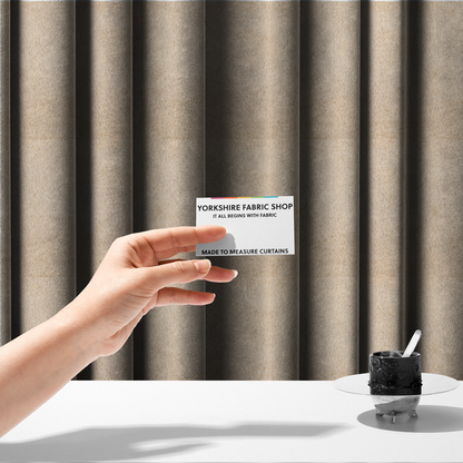 The fabric used to create these made-to-measure curtains is a high-quality faux fur fabric in a warm, sandy beige or light camel hue. The material features a dense, short-pile texture with a soft, uniform grain that gives it a velvety and plush appearance.