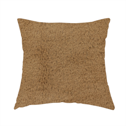 The fabric used to create this handmade cushion is a luxurious faux fur fabric in a rich tobacco or medium brown shade. The material features a dense, velvet-like pile that creates a soft, textured surface with a subtle matte finish. The deep, warm brown colour has a natural-looking depth, with fine fibres that catch the light to reveal a plush, high-density grain.