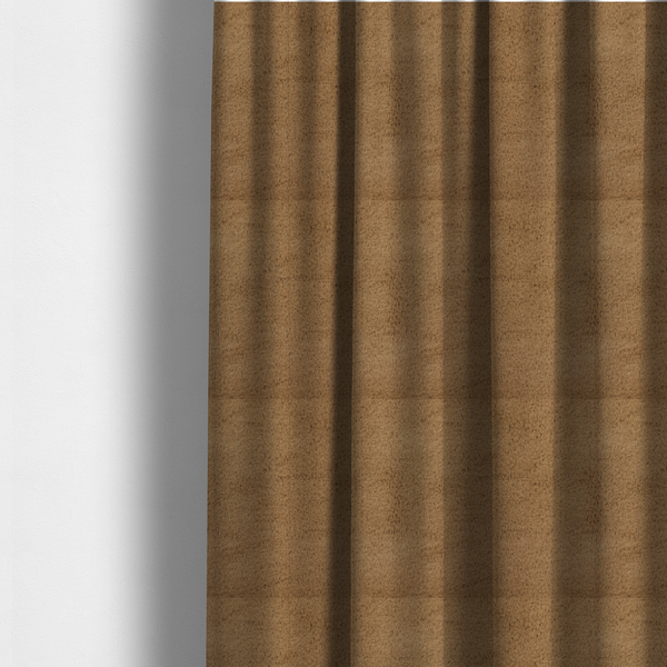 The fabric used to create these made-to-measure curtains is a luxurious faux fur fabric in a rich tobacco or medium brown shade. The material features a dense, velvet-like pile that creates a soft, textured surface with a subtle matte finish. The deep, warm brown colour has a natural-looking depth, with fine fibres that catch the light to reveal a plush, high-density grain.