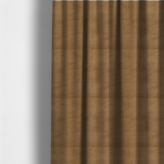The fabric used to create these made-to-measure curtains is a luxurious faux fur fabric in a rich tobacco or medium brown shade. The material features a dense, velvet-like pile that creates a soft, textured surface with a subtle matte finish. The deep, warm brown colour has a natural-looking depth, with fine fibres that catch the light to reveal a plush, high-density grain.