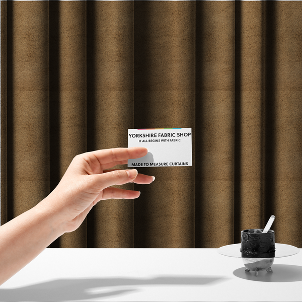 The fabric used to create these made-to-measure curtains is a luxurious faux fur fabric in a rich tobacco or medium brown shade. The material features a dense, velvet-like pile that creates a soft, textured surface with a subtle matte finish. The deep, warm brown colour has a natural-looking depth, with fine fibres that catch the light to reveal a plush, high-density grain.