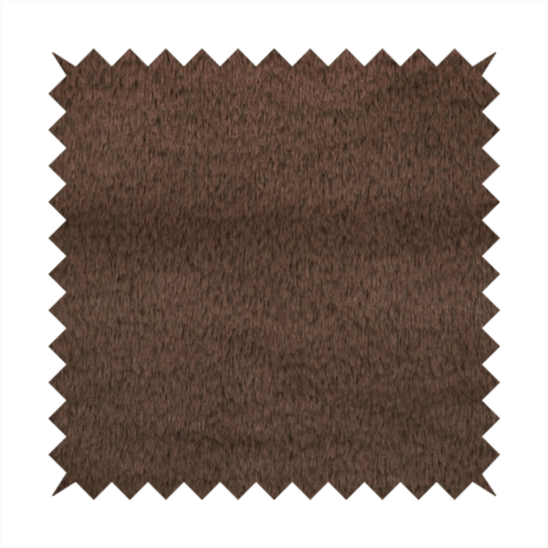 A luxurious faux fur fabric in a deep dark chocolate or espresso brown. The material features a dense, short-pile texture that creates a velvety and sophisticated appearance. The dark, cool-toned brown fibres are tightly packed, offering a soft matte finish with subtle shadows that highlight the fabric's thick and plush quality.
