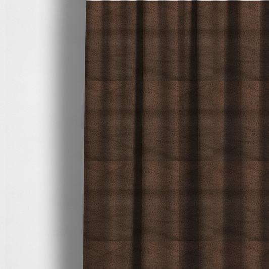 The fabric used to create these made-to-measure curtains is a luxurious faux fur fabric in a deep dark chocolate or espresso brown. The material features a dense, short-pile texture that creates a velvety and sophisticated appearance. The dark, cool-toned brown fibres are tightly packed, offering a soft matte finish with subtle shadows that highlight the fabric's thick and plush quality.