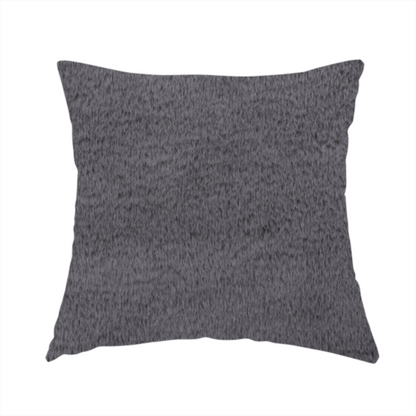The fabric used to create this handmade cushion is a plush faux fur fabric in a deep charcoal or slate grey. The material has a dense, short-pile texture that creates a soft, uniform surface with a subtle velvety sheen. The cool-toned grey fibres are tightly packed, providing a rich matte finish that catches the light to reveal fine depth and a luxurious hand-feel.