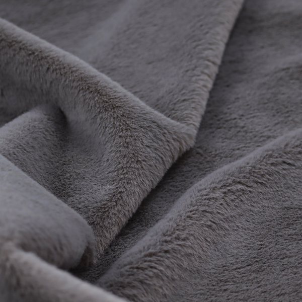 A plush faux fur fabric in a deep charcoal or slate grey. The material has a dense, short-pile texture that creates a soft, uniform surface with a subtle velvety sheen. The cool-toned grey fibres are tightly packed, providing a rich matte finish that catches the light to reveal fine depth and a luxurious hand-feel.