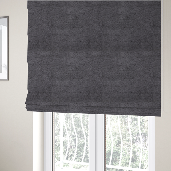 The fabric used to create these Roman blinds is a plush faux fur fabric in a deep charcoal or slate grey. The material has a dense, short-pile texture that creates a soft, uniform surface with a subtle velvety sheen. The cool-toned grey fibres are tightly packed, providing a rich matte finish that catches the light to reveal fine depth and a luxurious hand-feel.