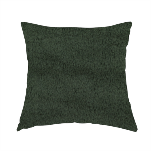 The fabric used to create this handmade cushion is a plush faux fur fabric in a rich forest green or deep pine colour. The material has a dense, short-pile texture that creates a velvety surface with a sophisticated matte finish. The dark green fibres are tightly packed, showing subtle tonal variations and soft shadows that give the fabric a luxurious sense of depth.
