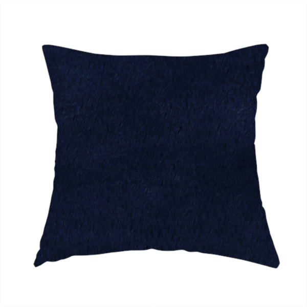 The fabric used to create this handmade cushion is a plush faux fur fabric in a deep, classic navy blue. The material features a dense, short-pile texture that creates a rich, velvety surface with a sophisticated matte finish. The tightly packed dark blue fibres catch the light to show subtle tonal depth and soft shadows, suggesting an exceptionally soft and luxurious hand-feel.