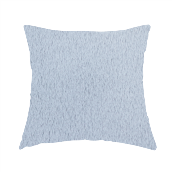 The fabric used to create this handmade cushion is a plush faux fur fabric in a bright silver or icy light grey shade. The material has a dense, short-pile texture that creates a soft, uniform surface with a delicate matte sheen. The cool, pale grey fibres are tightly packed, showing subtle light-and-shadow variations that give the fabric a clean, velvety depth.