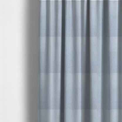 The fabric used to create these made-to-measure curtains is a plush faux fur fabric in a bright silver or icy light grey shade. The material has a dense, short-pile texture that creates a soft, uniform surface with a delicate matte sheen. The cool, pale grey fibres are tightly packed, showing subtle light-and-shadow variations that give the fabric a clean, velvety depth.