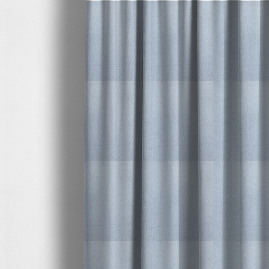 The fabric used to create these made-to-measure curtains is a plush faux fur fabric in a bright silver or icy light grey shade. The material has a dense, short-pile texture that creates a soft, uniform surface with a delicate matte sheen. The cool, pale grey fibres are tightly packed, showing subtle light-and-shadow variations that give the fabric a clean, velvety depth.