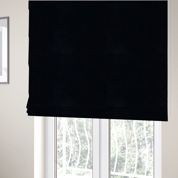 The fabric used to create these Roman blinds is a luxurious faux fur fabric in a solid, true jet black. The material showcases an exceptionally dense, short-pile texture with a soft, uniform grain that creates a deep matte finish. Because of its high density, the fabric absorbs light significantly, resulting in a rich, velvety appearance with minimal sheen.