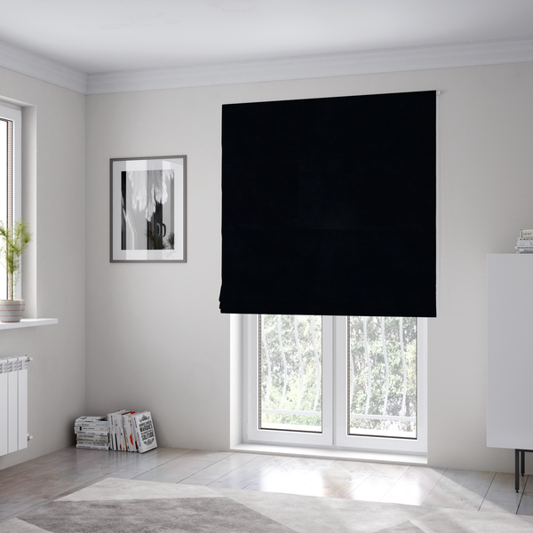 The fabric used to create these Roman blinds is a luxurious faux fur fabric in a solid, true jet black. The material showcases an exceptionally dense, short-pile texture with a soft, uniform grain that creates a deep matte finish. Because of its high density, the fabric absorbs light significantly, resulting in a rich, velvety appearance with minimal sheen.