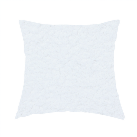 The fabric used to create this handmade cushion features a high-pile, textured surface that mimics the cosy appearance of shearling or faux sheepskin.