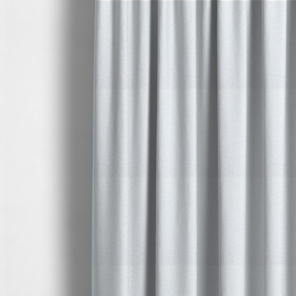 The fabric used to create these made-to-measure curtains features a high-pile, textured surface that mimics the cosy appearance of shearling or faux sheepskin.