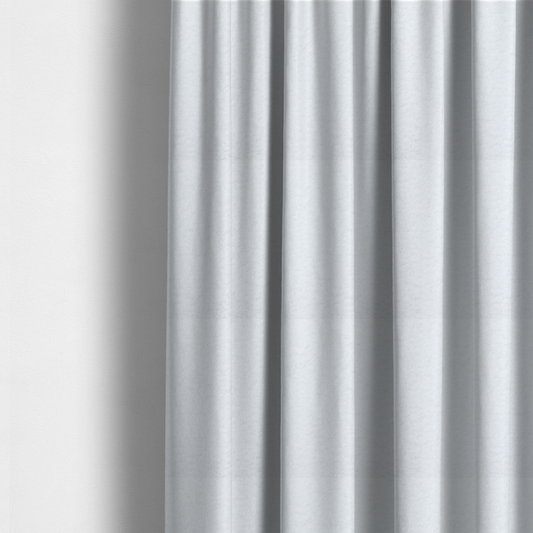 The fabric used to create these made-to-measure curtains features a high-pile, textured surface that mimics the cosy appearance of shearling or faux sheepskin.