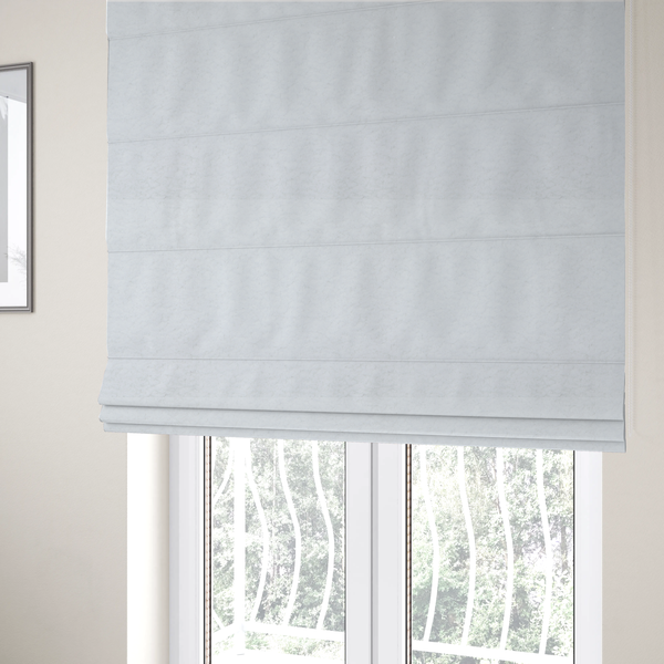 The fabric used to create these Roman blinds features a high-pile, textured surface that mimics the cosy appearance of shearling or faux sheepskin.
