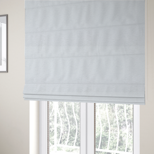 The fabric used to create these Roman blinds features a high-pile, textured surface that mimics the cosy appearance of shearling or faux sheepskin.
