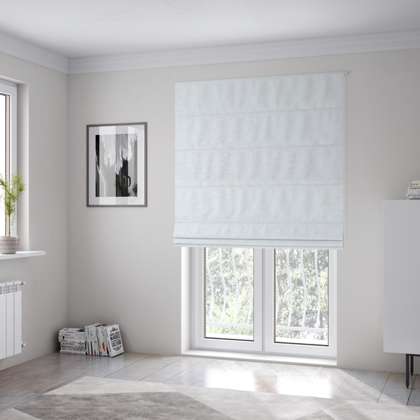 The fabric used to create these Roman blinds features a high-pile, textured surface that mimics the cosy appearance of shearling or faux sheepskin.