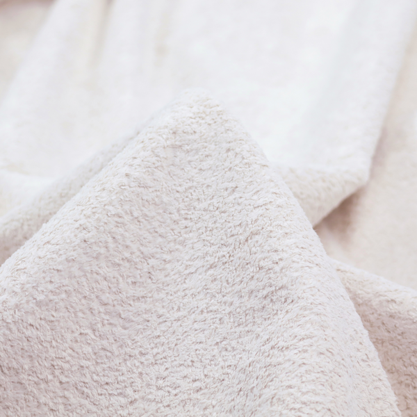 This fabric features a high-pile faux fur texture that provides a lush, tactile experience with a soft and cosy aesthetic.