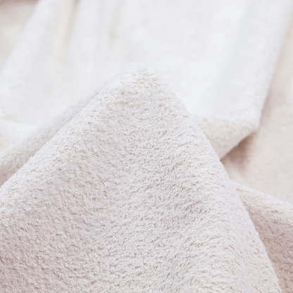 This fabric features a high-pile faux fur texture that provides a lush, tactile experience with a soft and cosy aesthetic.