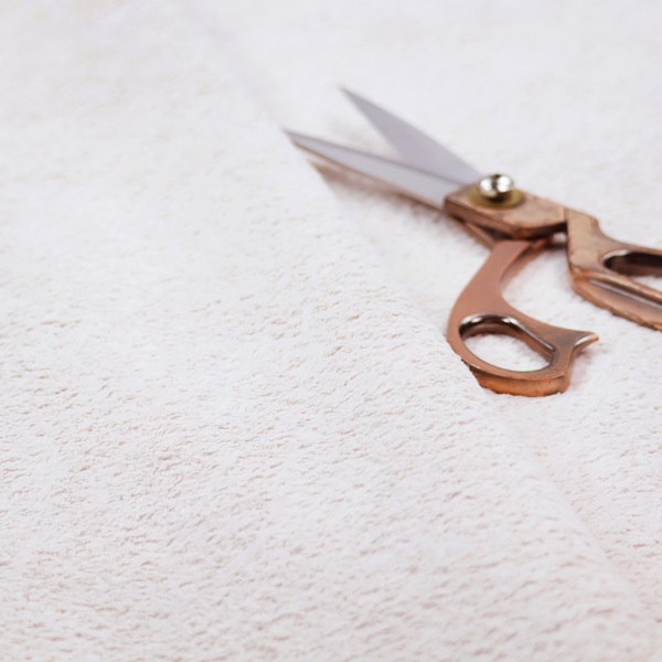 This fabric features a high-pile faux fur texture that provides a lush, tactile experience with a soft and cosy aesthetic.