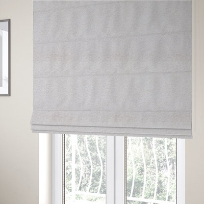 The fabric used to create these Roman blinds features a high-pile faux fur texture that provides a lush, tactile experience with a soft and cosy aesthetic.
