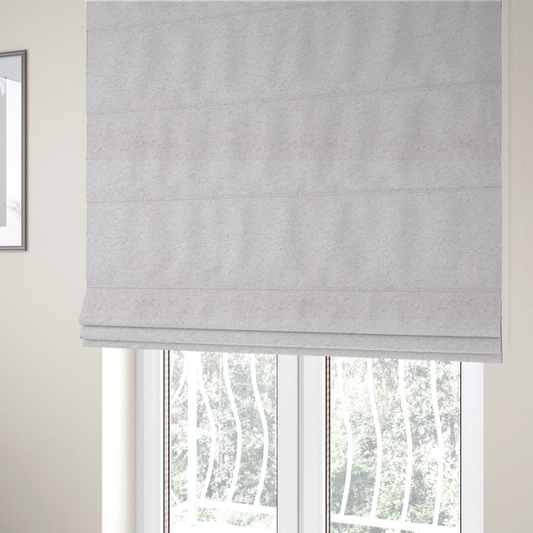 The fabric used to create these Roman blinds features a high-pile faux fur texture that provides a lush, tactile experience with a soft and cosy aesthetic.