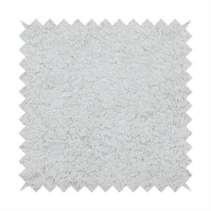 This fabric features a high-pile faux fur texture that offers a cool-toned, plush aesthetic with a rich tactile quality.